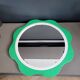 Plastic flower mirror by Finnish designer Makisen Kuvastin