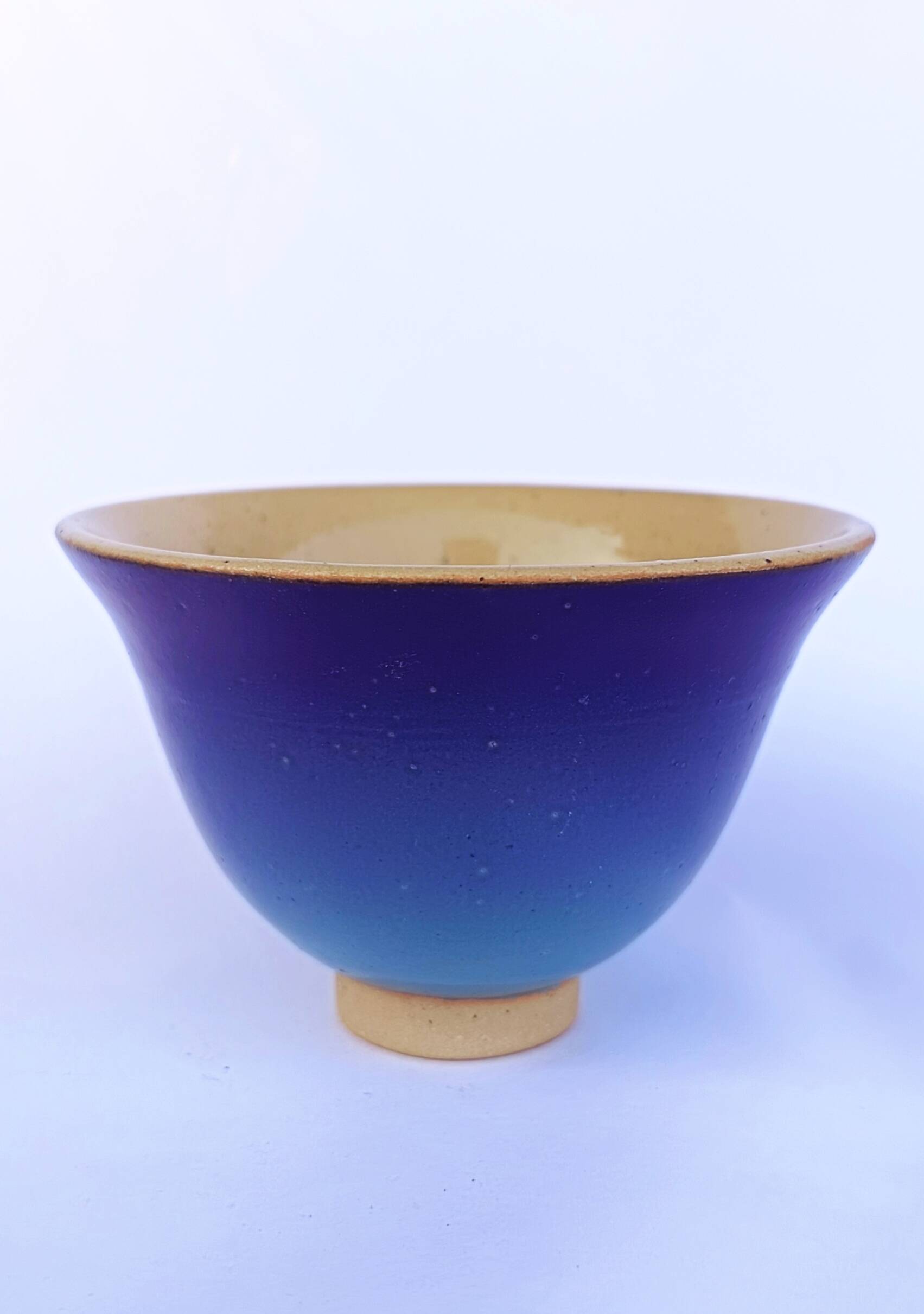 Blue glazed stoneware bowl on a foot, signed SP, Puisaye.