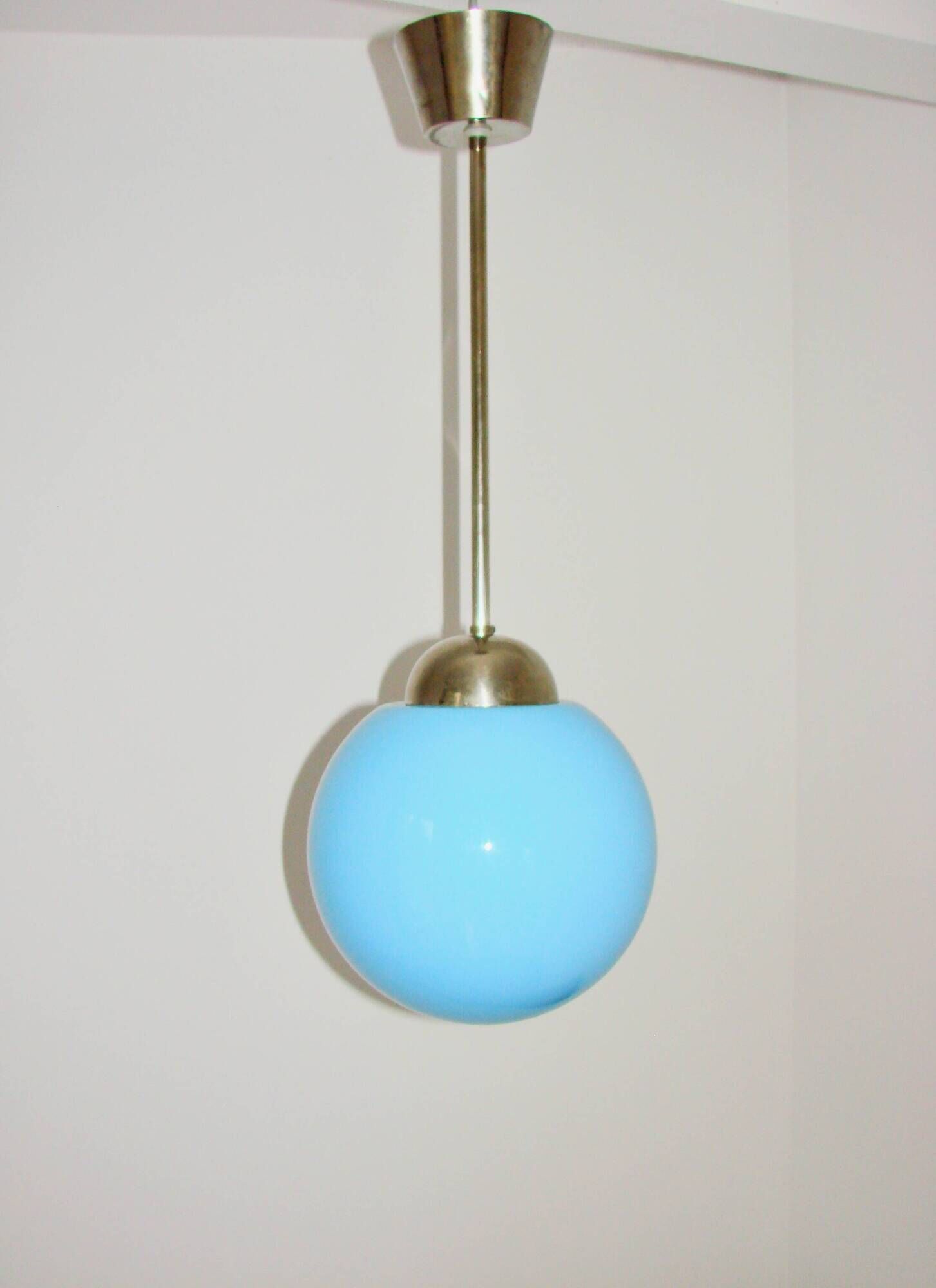 A pendant lamp with a blue glass shade, 1940s.