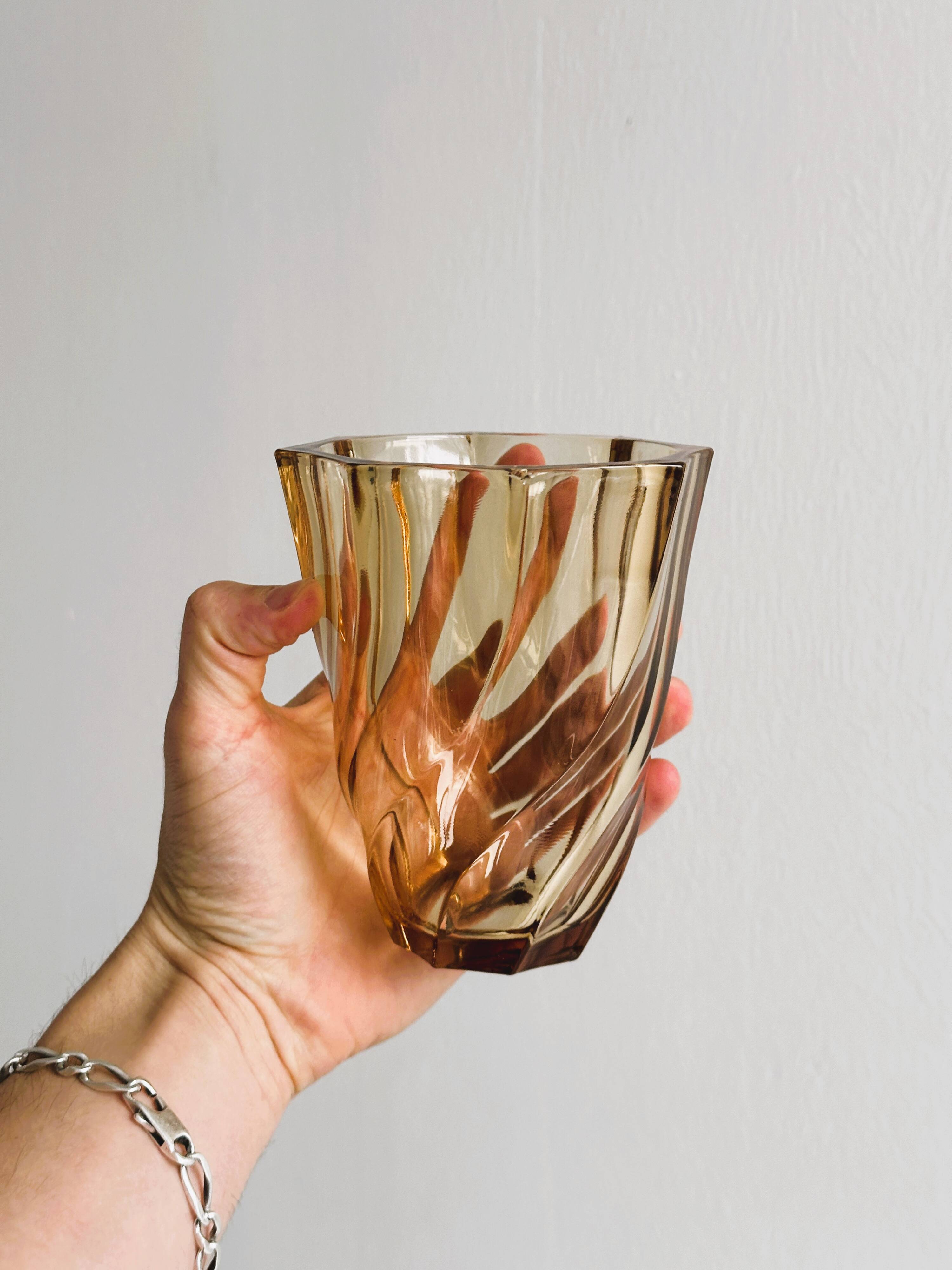 Small translucent pink twisted glass vase