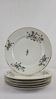 6 flat plates decorated with barbs