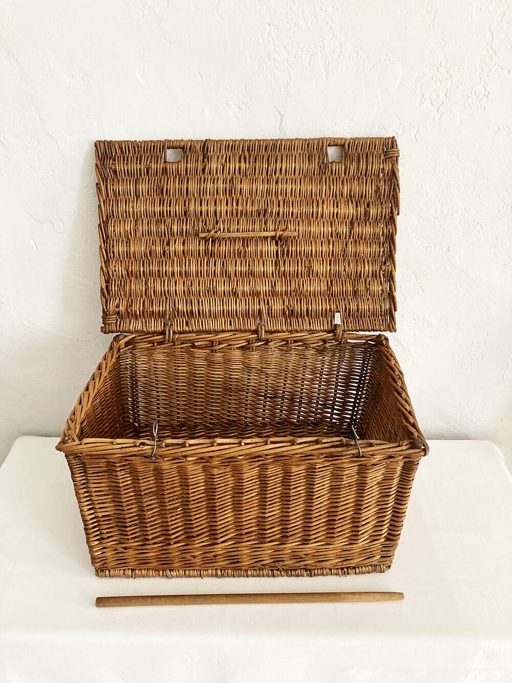 Old wicker basket with closure and handle