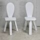 Pair of tripod chairs, gouged seats. Brutalist, circa 1960. Painted wood.