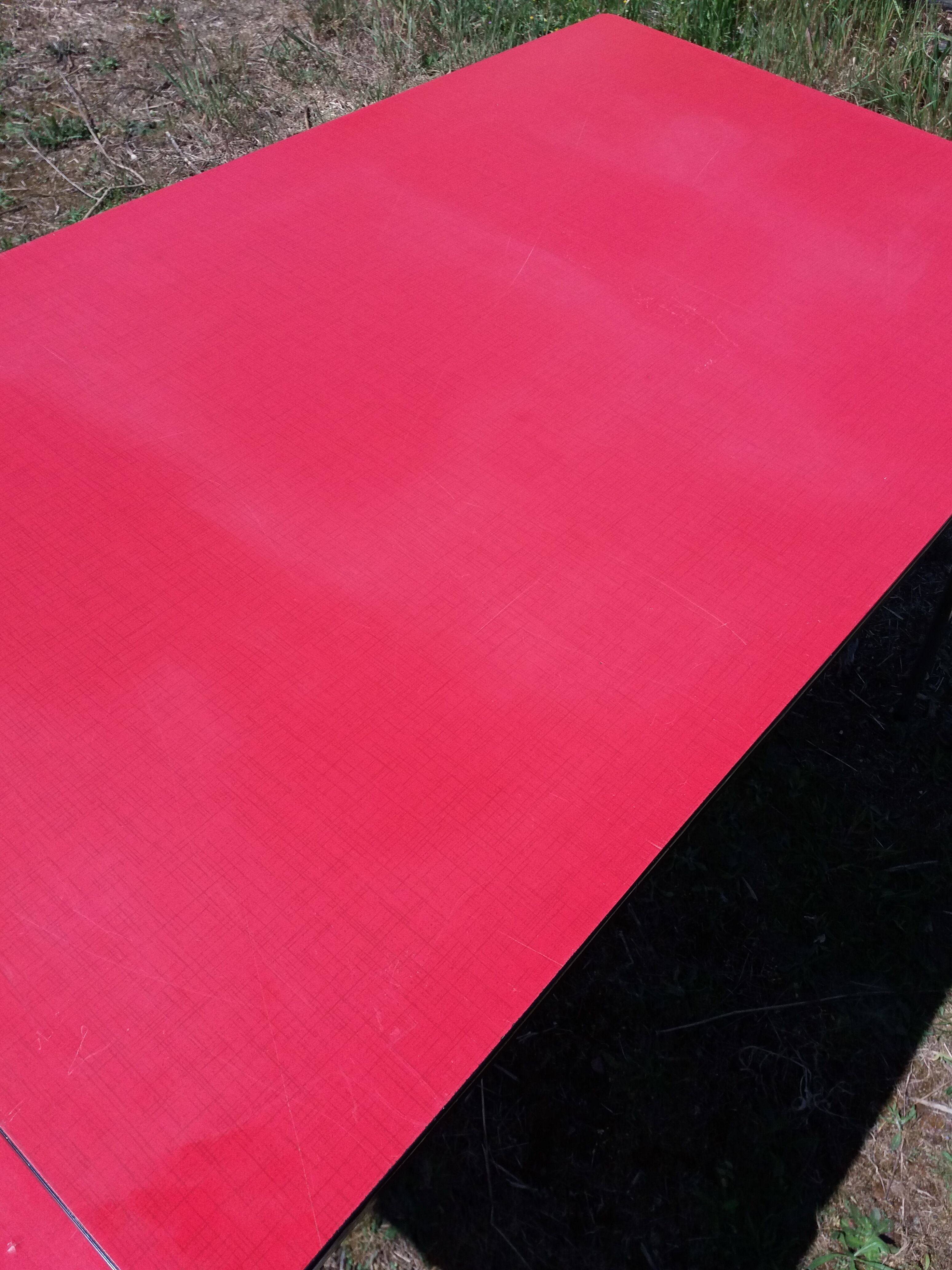 Dining table with red formica extensions