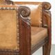 Antique armchair made of sheepskin and wood with decorative nails