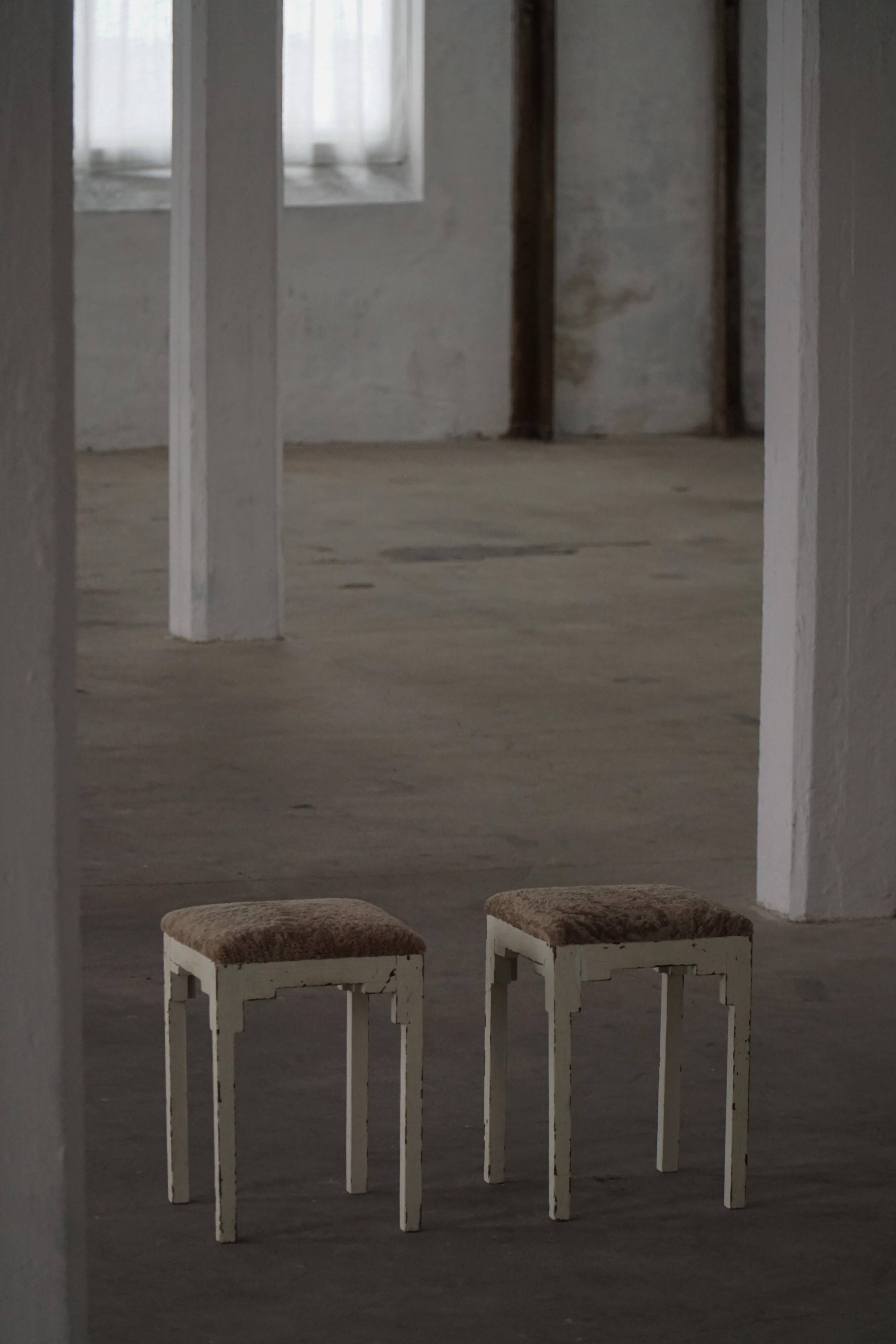 A pair of antique Danish stools, seats in lambswool, late 19th century.