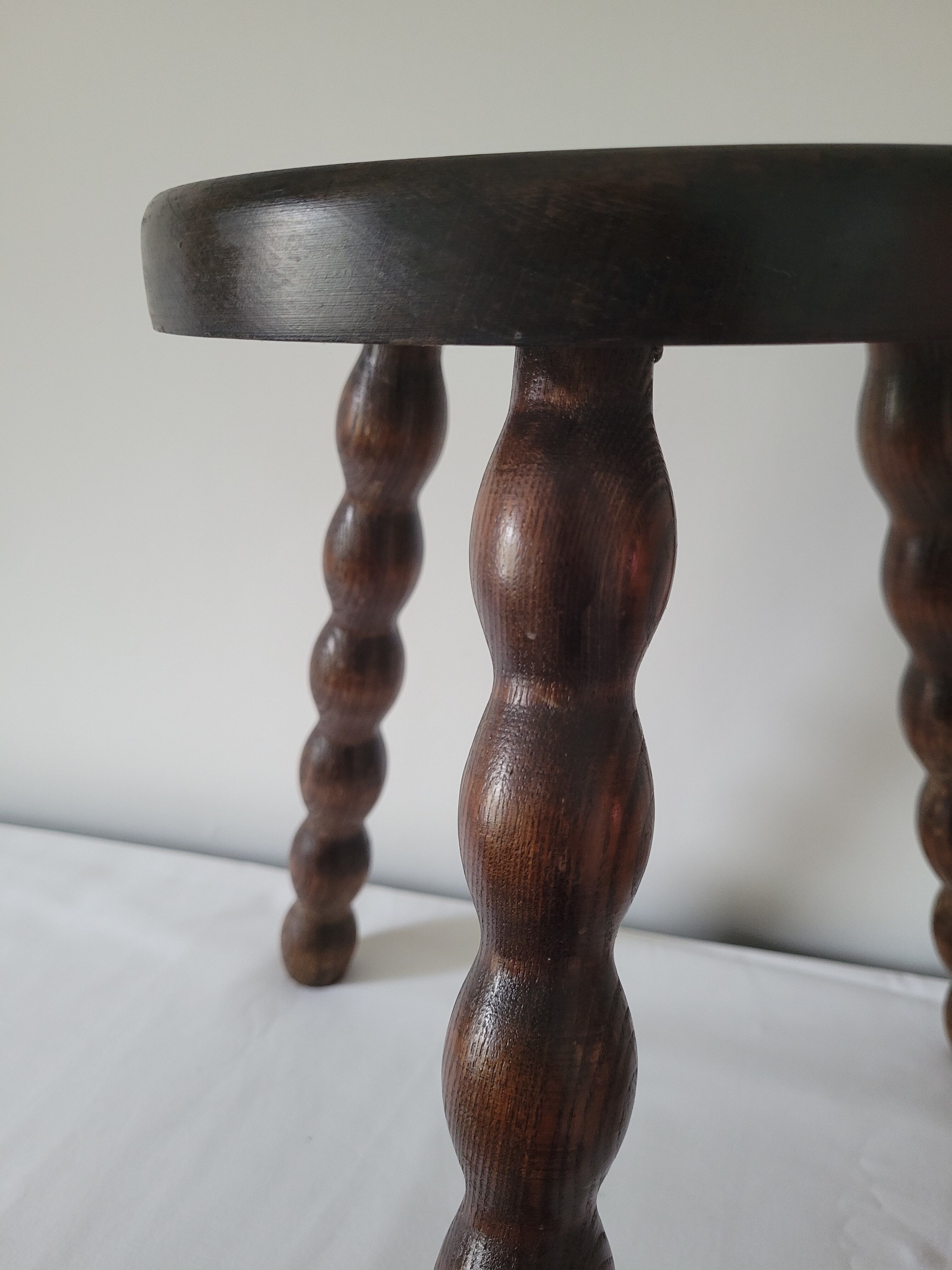 Brutalist stool with turned wooden legs