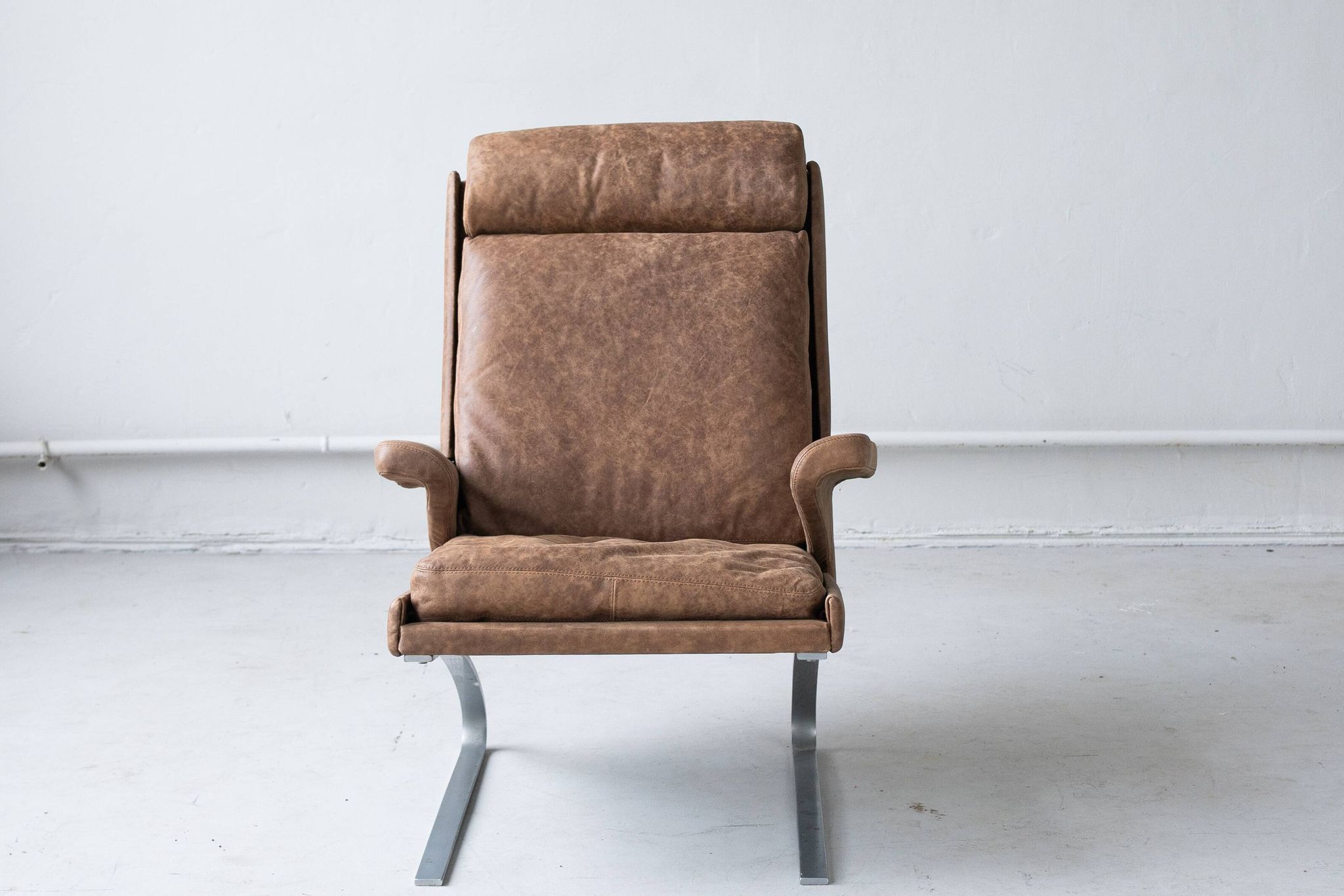 Vintage swing armchair and stool in leather by reinhold adolf for cor, 1970s, set of 2