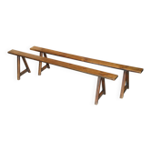 Pair of antique Victorian trestle benches in fruitwood.