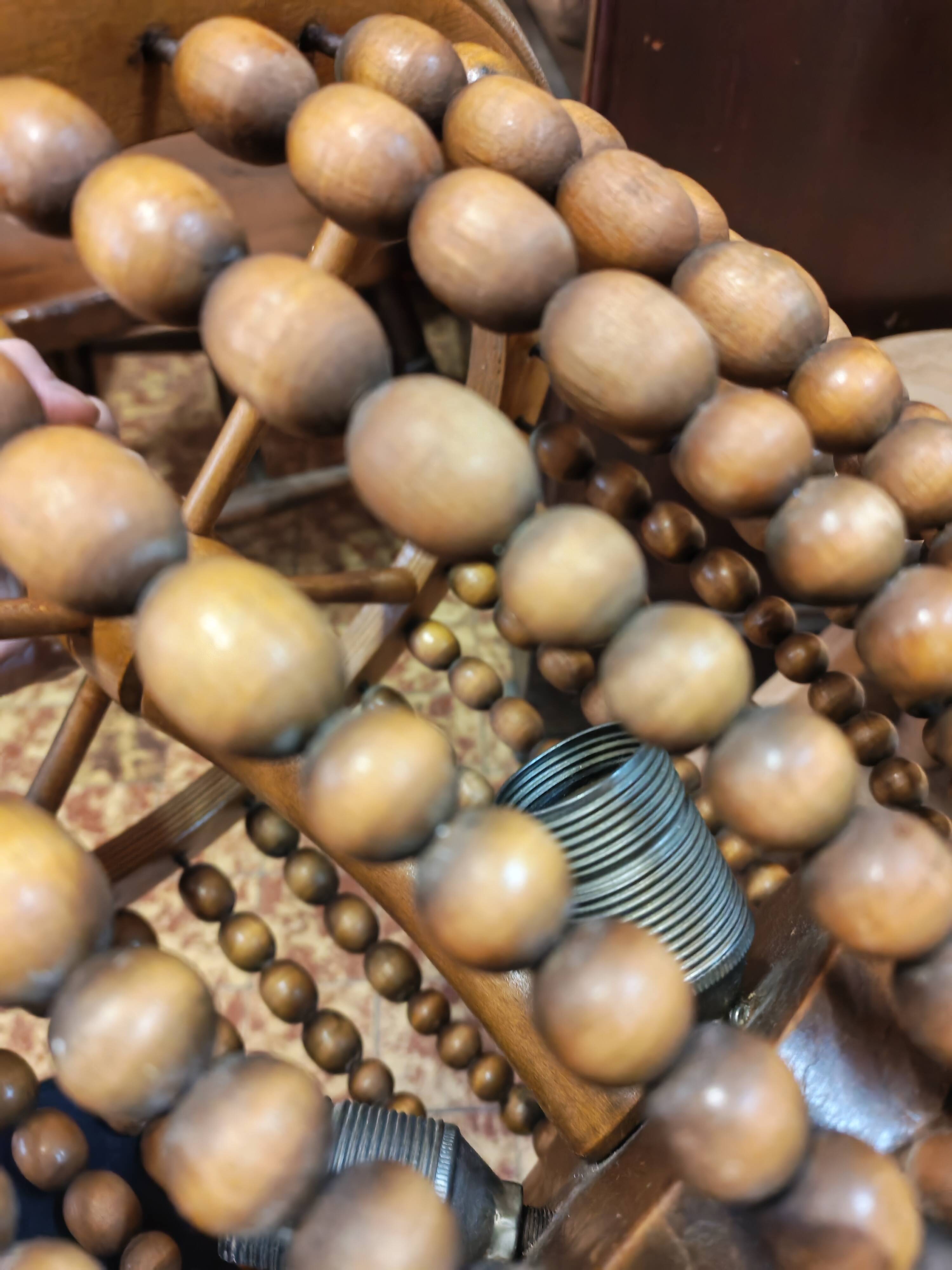 Vintage wooden turned cage chandelier with beads from the 1960s.