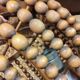 Vintage wooden turned cage chandelier with beads from the 1960s.