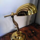 Articulated shell lamp in gold metal