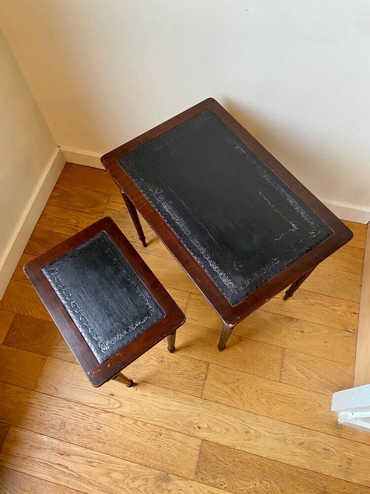 Dark wood and black leather tables
