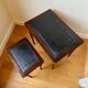 Dark wood and black leather tables