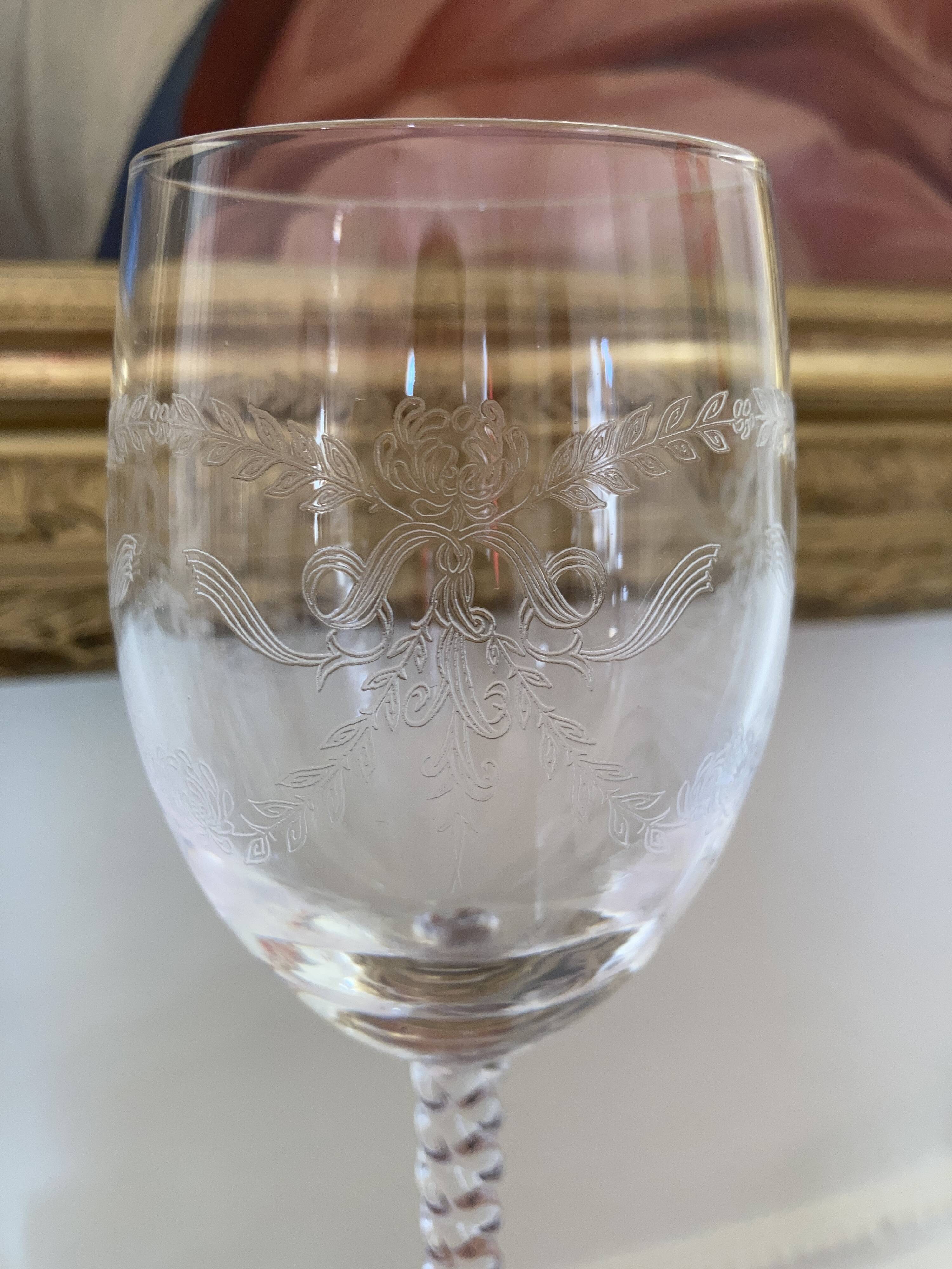 Set of 9 tall twisted and engraved crystal wine glasses