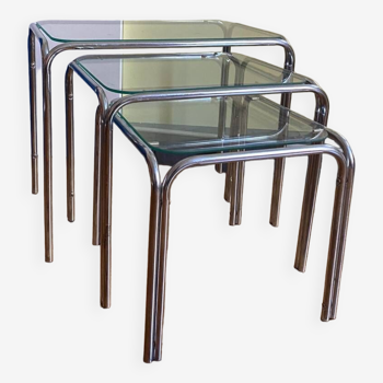 Nesting tables in chrome metal and white glass