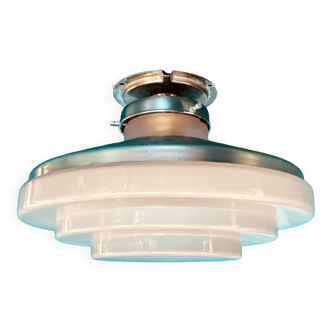 Round ceiling light with floors in glass and vintage industrial metal decoration