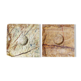 Pair of brutalist travertine candle holders