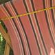 vintage wooden deck chair with striped fabric and footrest