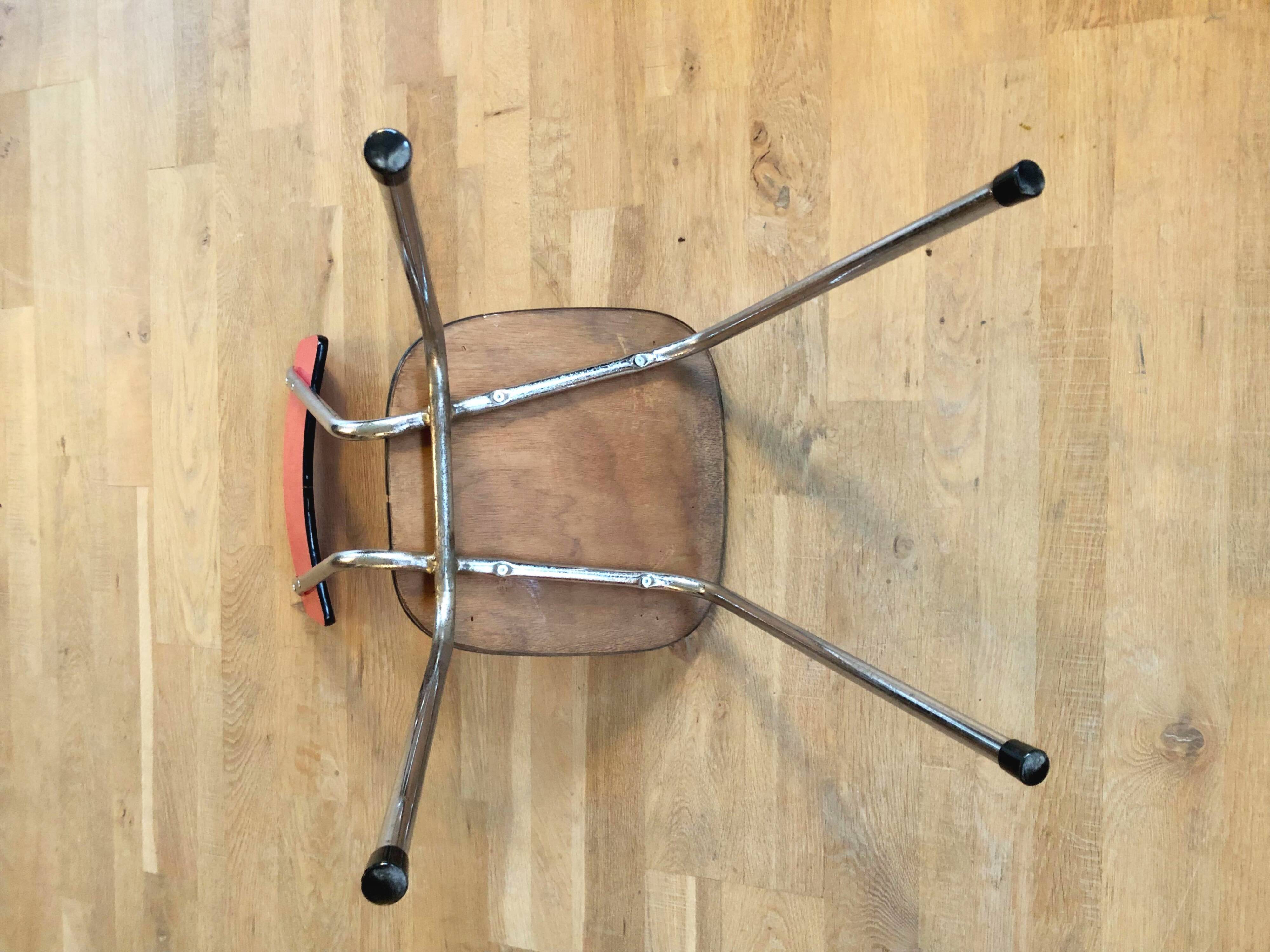Duo of red formica chairs
