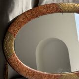 Small oval Art Deco mirror in brown and gold 33x54.
