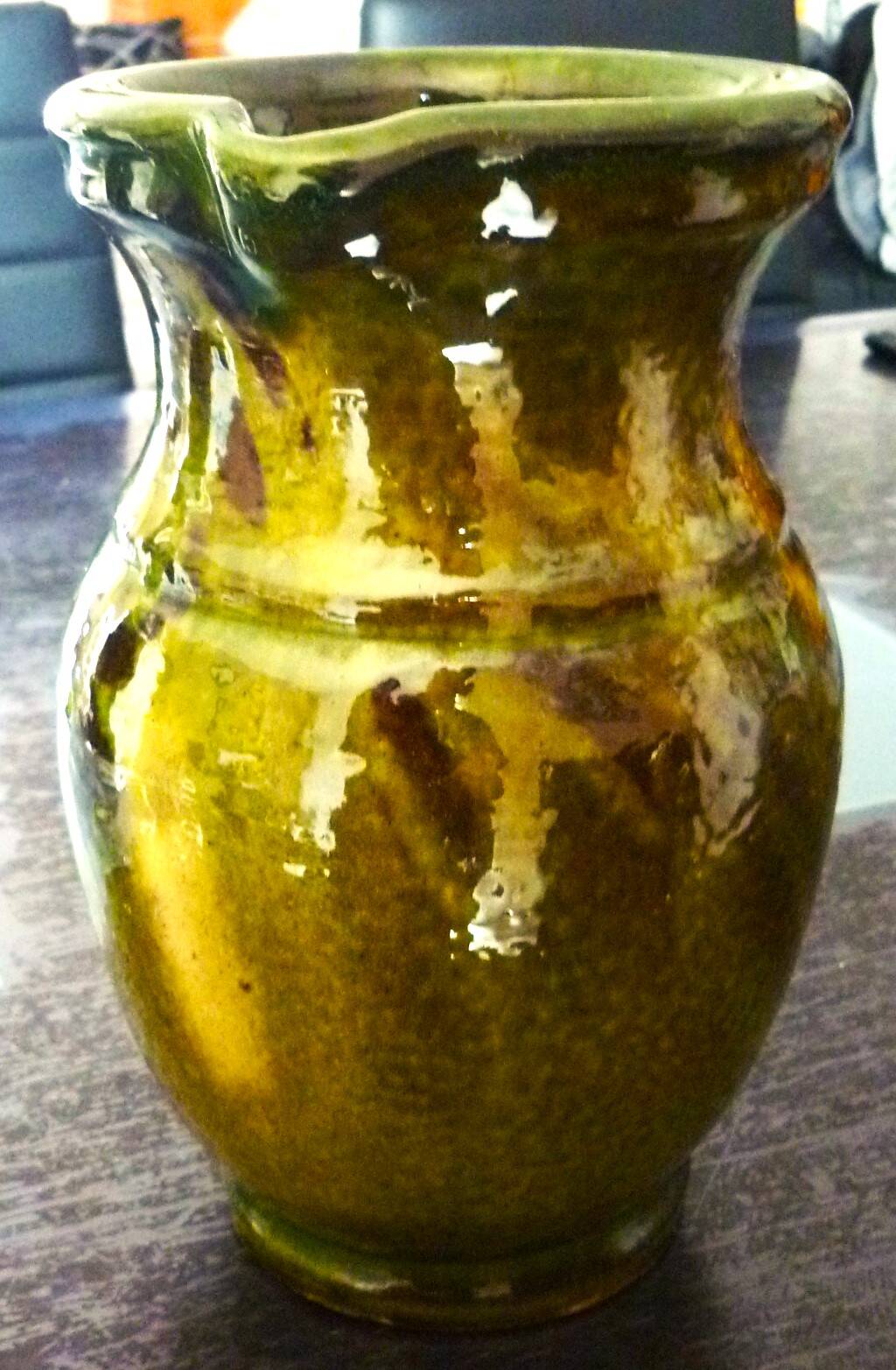 Pitcher vase, thick green glazed terracotta, signature to be identified