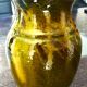 Pitcher vase, thick green glazed terracotta, signature to be identified