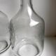 Pair of wine decanters in molded glass and engraved years 50-60