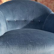 Vintage blue velvet frog chair, a timeless comfortable piece.