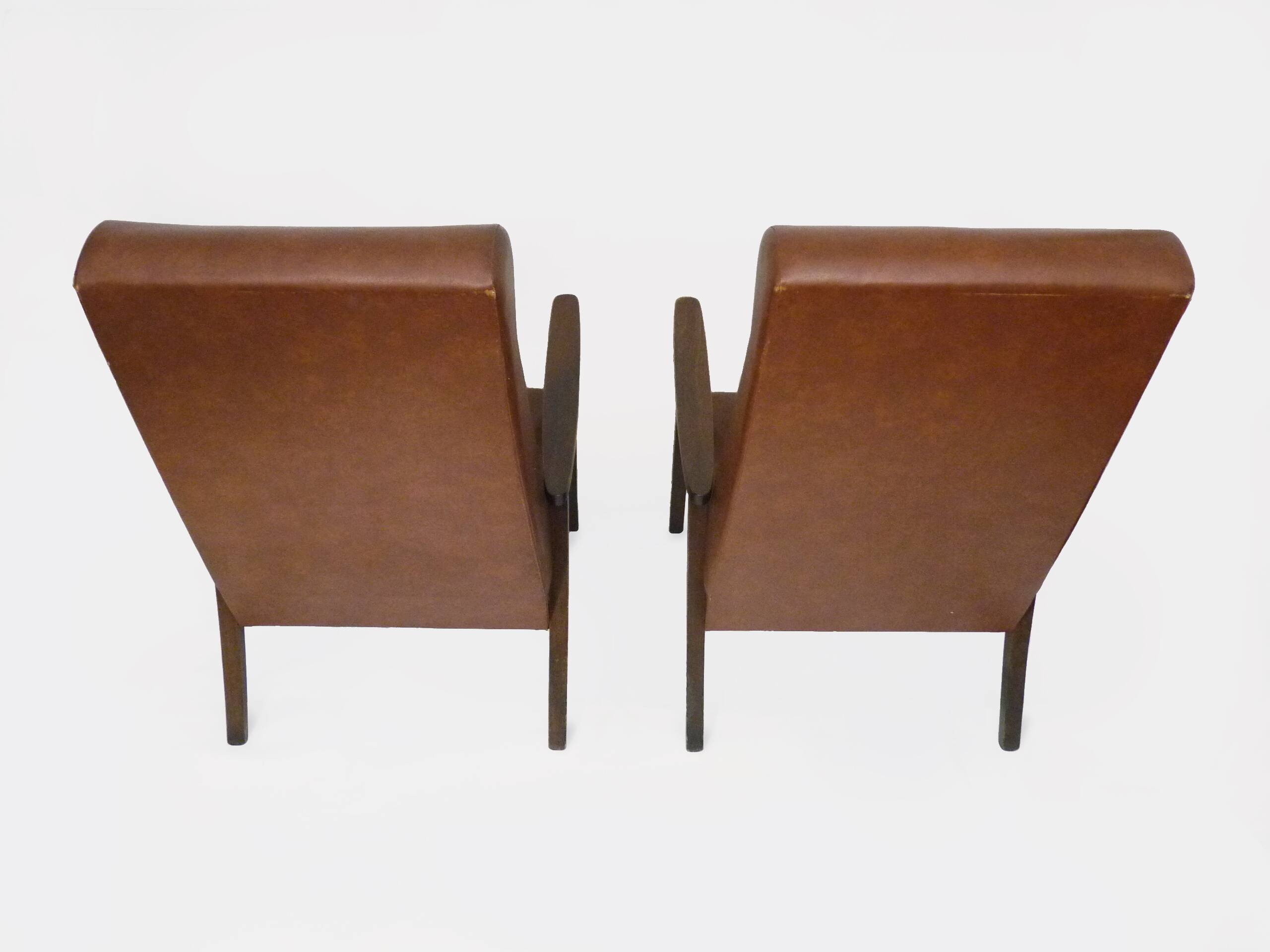 Pair of Scandinavian armchairs in brown leatherette and wood from the 50s and 60s