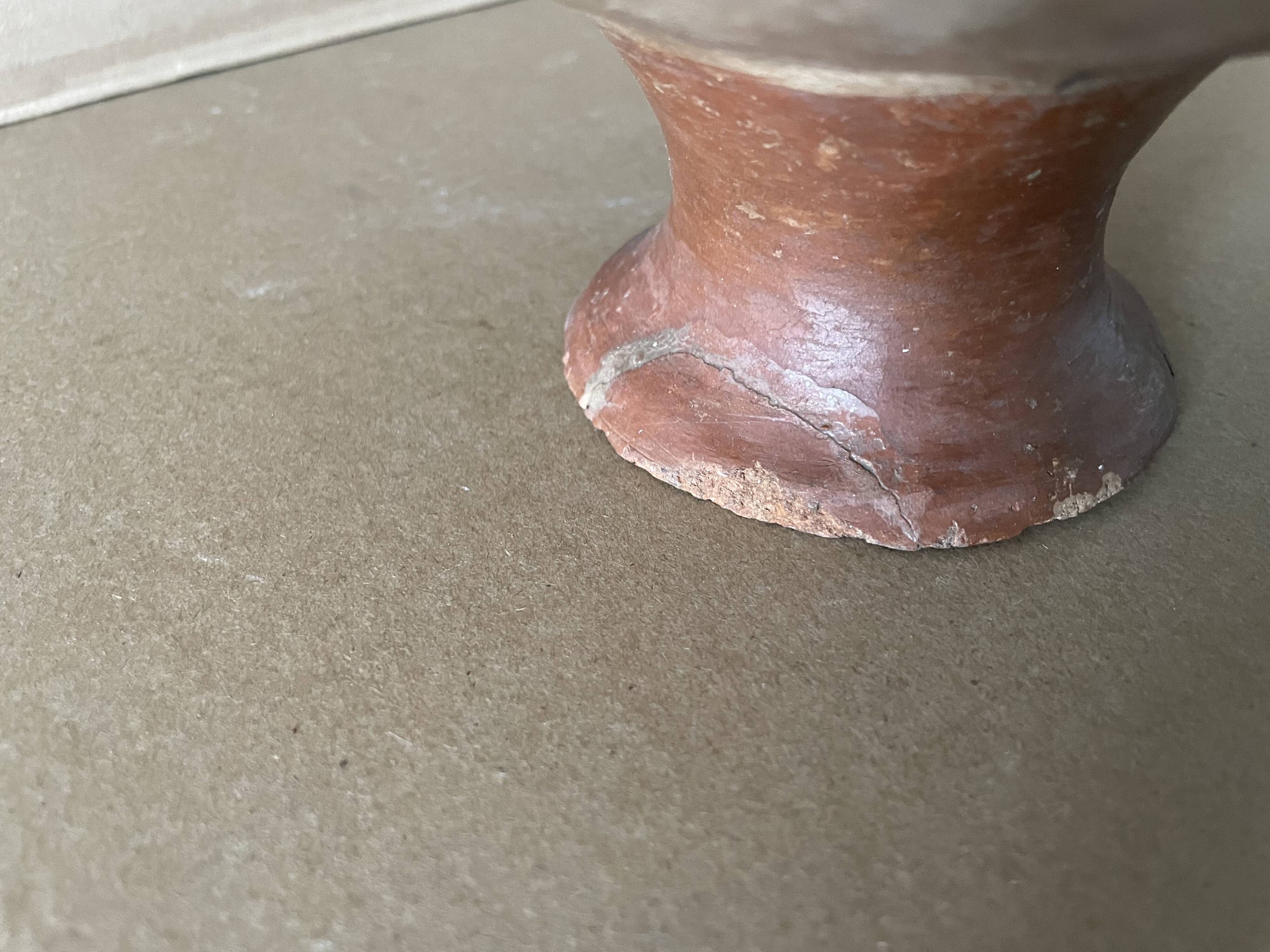 Antique terracotta cup