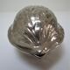 silver metal nutcracker in the shape of vintage walnuts