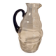 Glass carafe with wavy body and blue handle