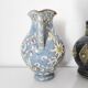Two small blue ceramic vases