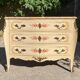 Curved Louis XV style commode in marble with painted floral decoration.