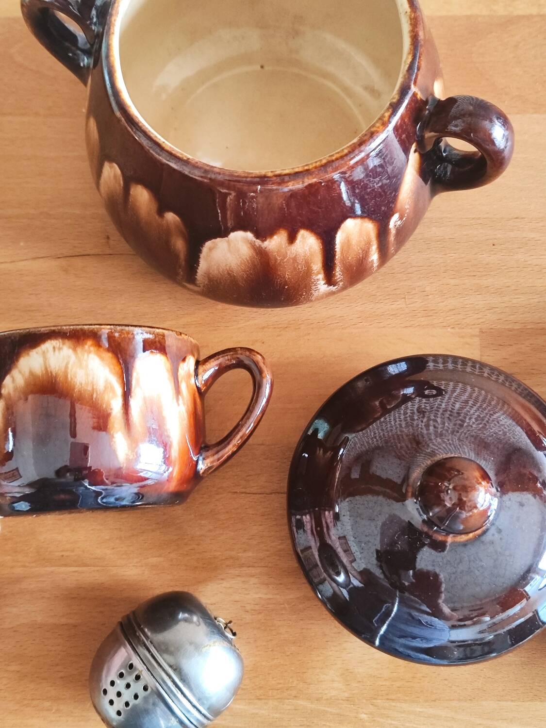 Vintage coffee service in glazed brown ceramic.