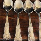 A set of 7 large metal shell spoons