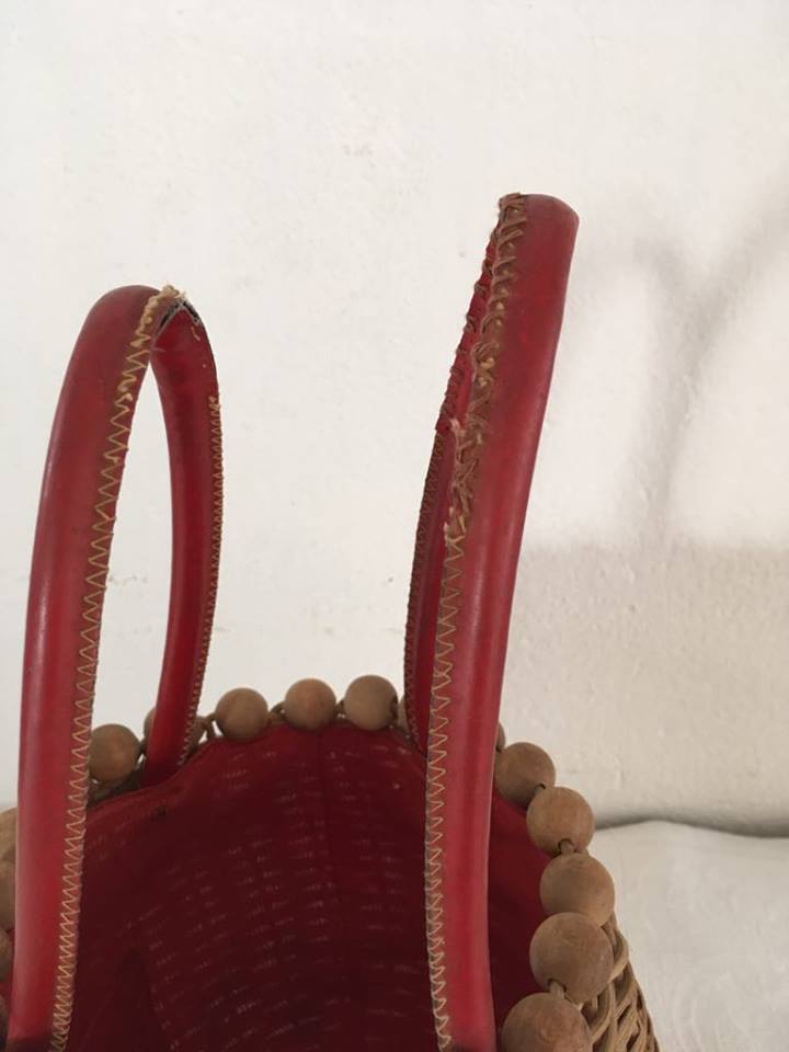 Wicker basket with a wooden bead border