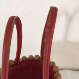 Wicker basket with a wooden bead border