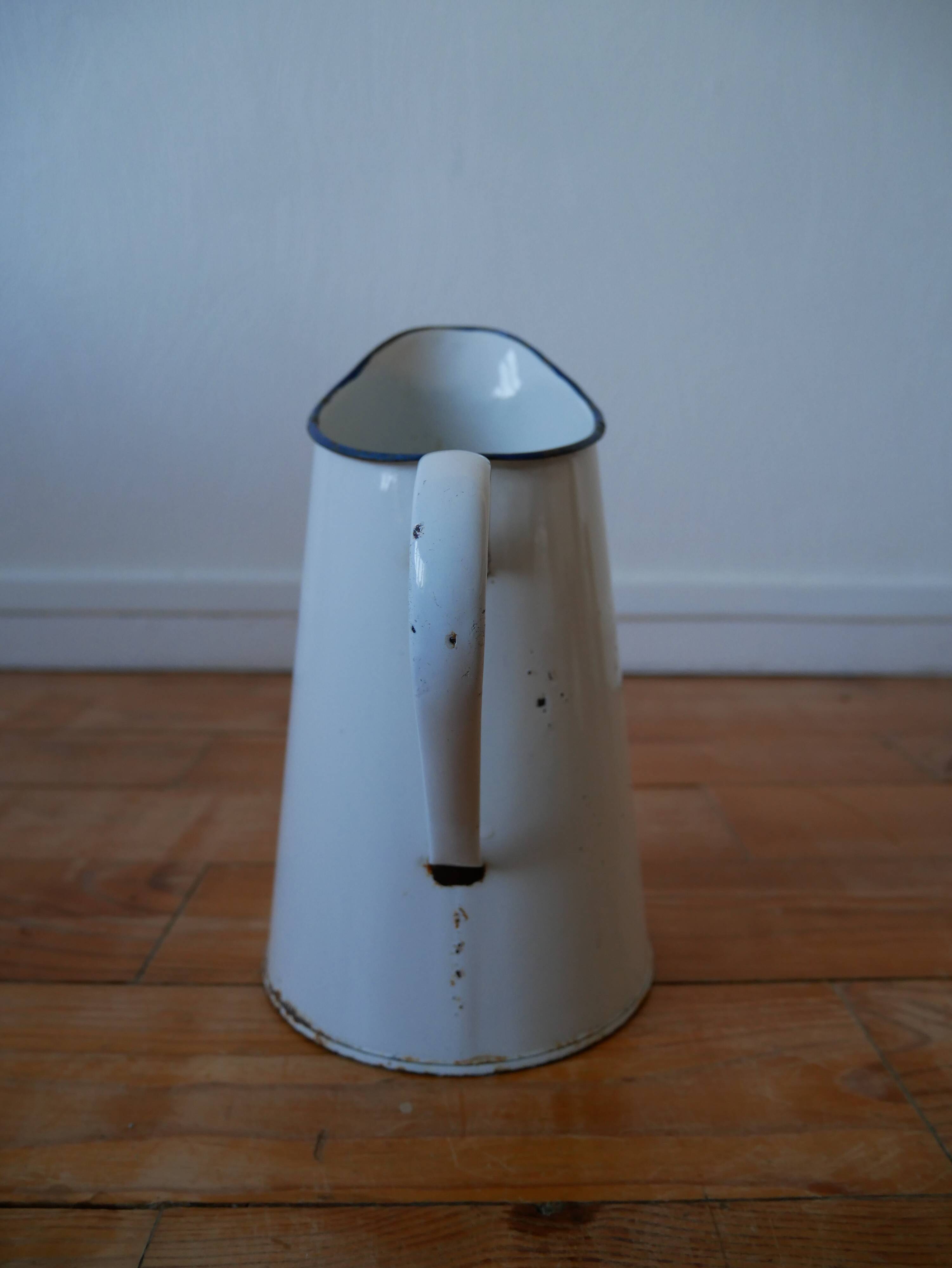 White enamelled metal broc