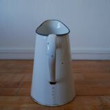 White enamelled metal broc