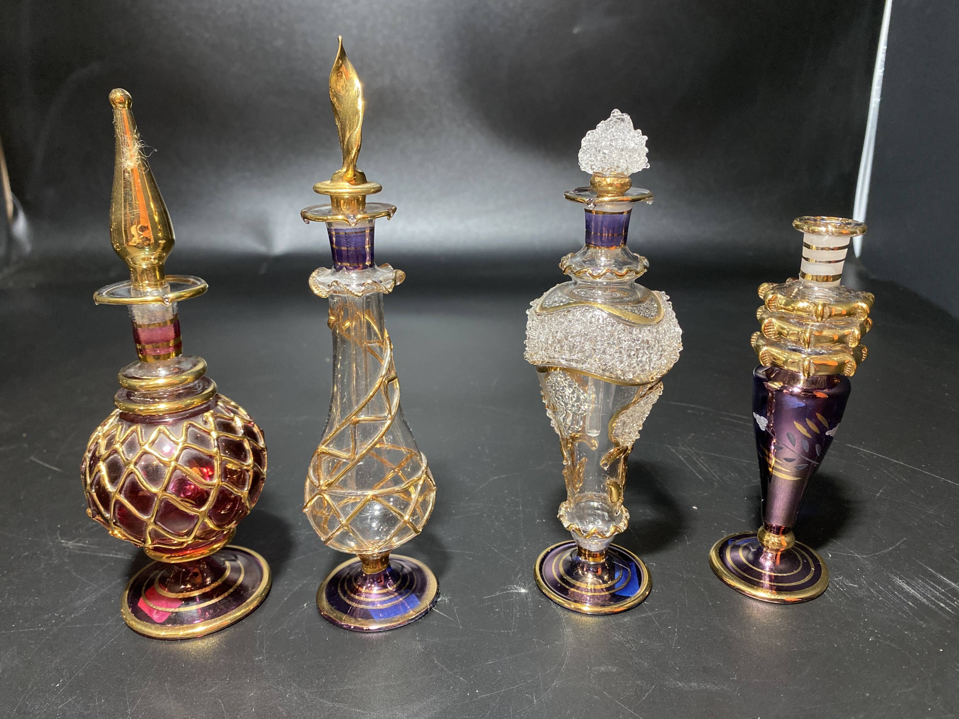 Set of 8 blown glass perfume bottles gilded with 12 carat gold