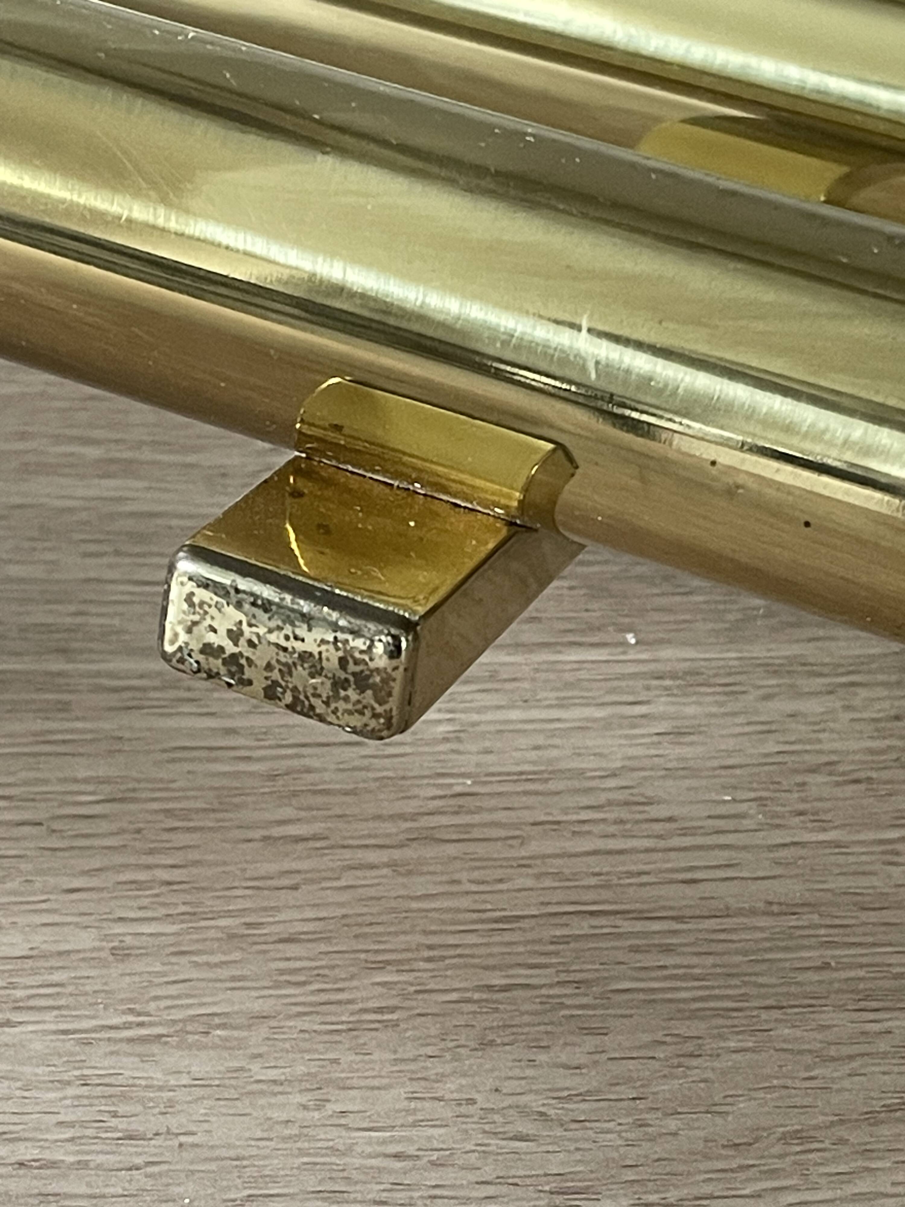 Tubular wall sconces in brass, Italian design from the 1970s, attributed.