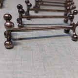 17 Christofle silver-plated knife rests in the Atonium model.