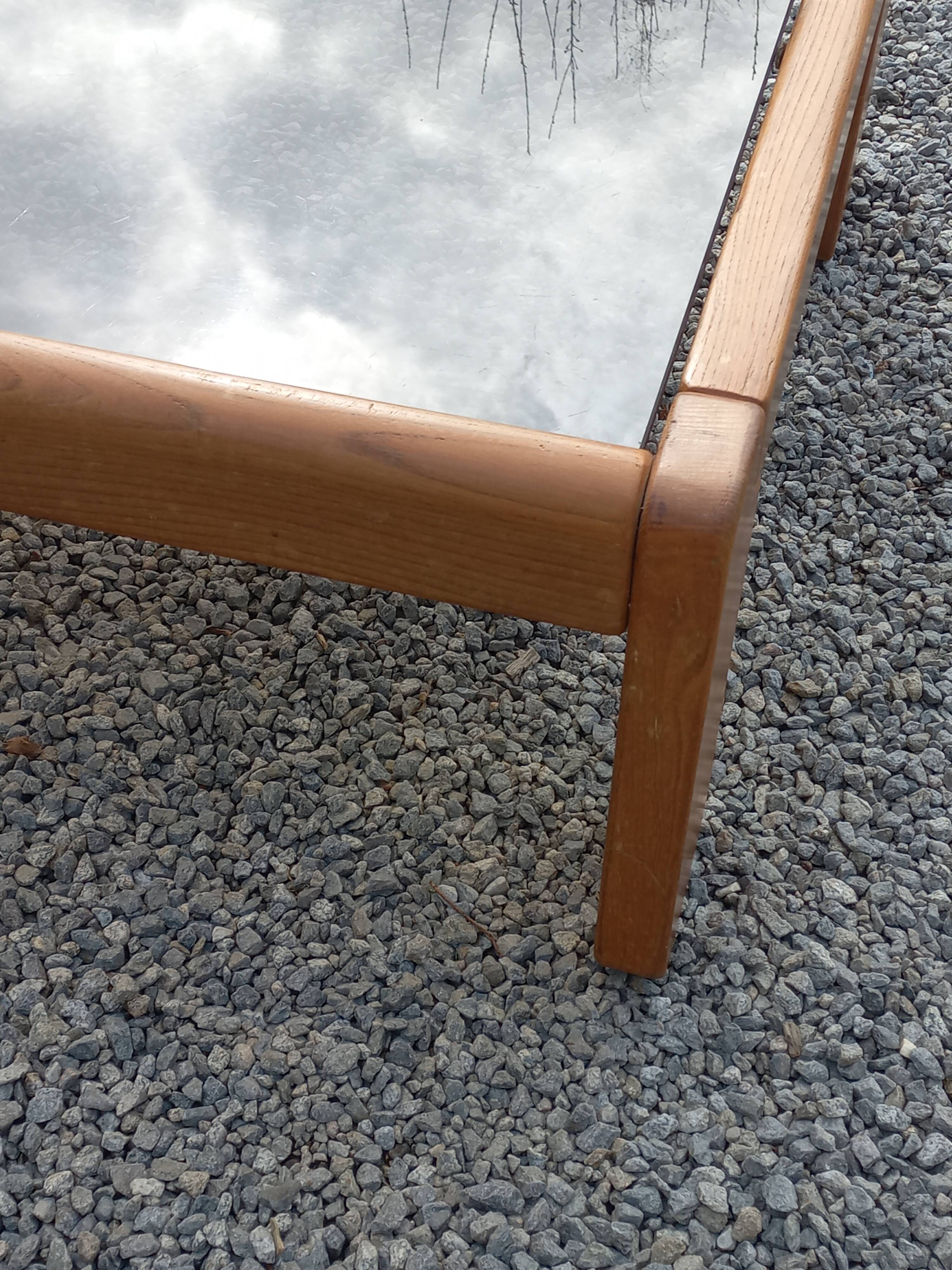 Coffee table from Regain in solid elm with a smoked glass top.