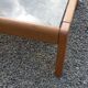 Coffee table from Regain in solid elm with a smoked glass top.