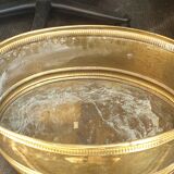 Oval brass planter with large handle