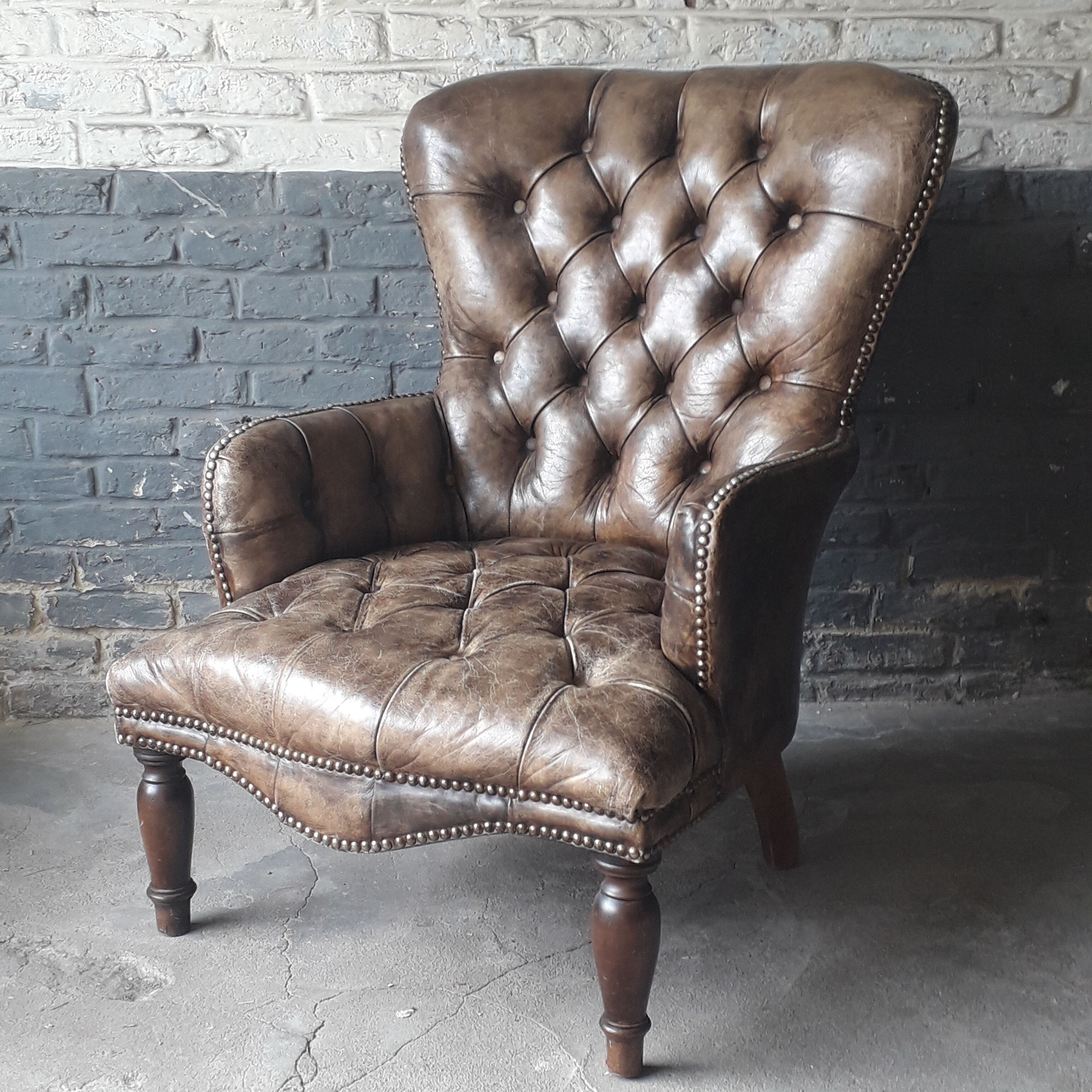 Fauteuil Chesterfield antique