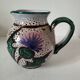 Pitcher with thistle motif by André Georges Pougues les Eaux