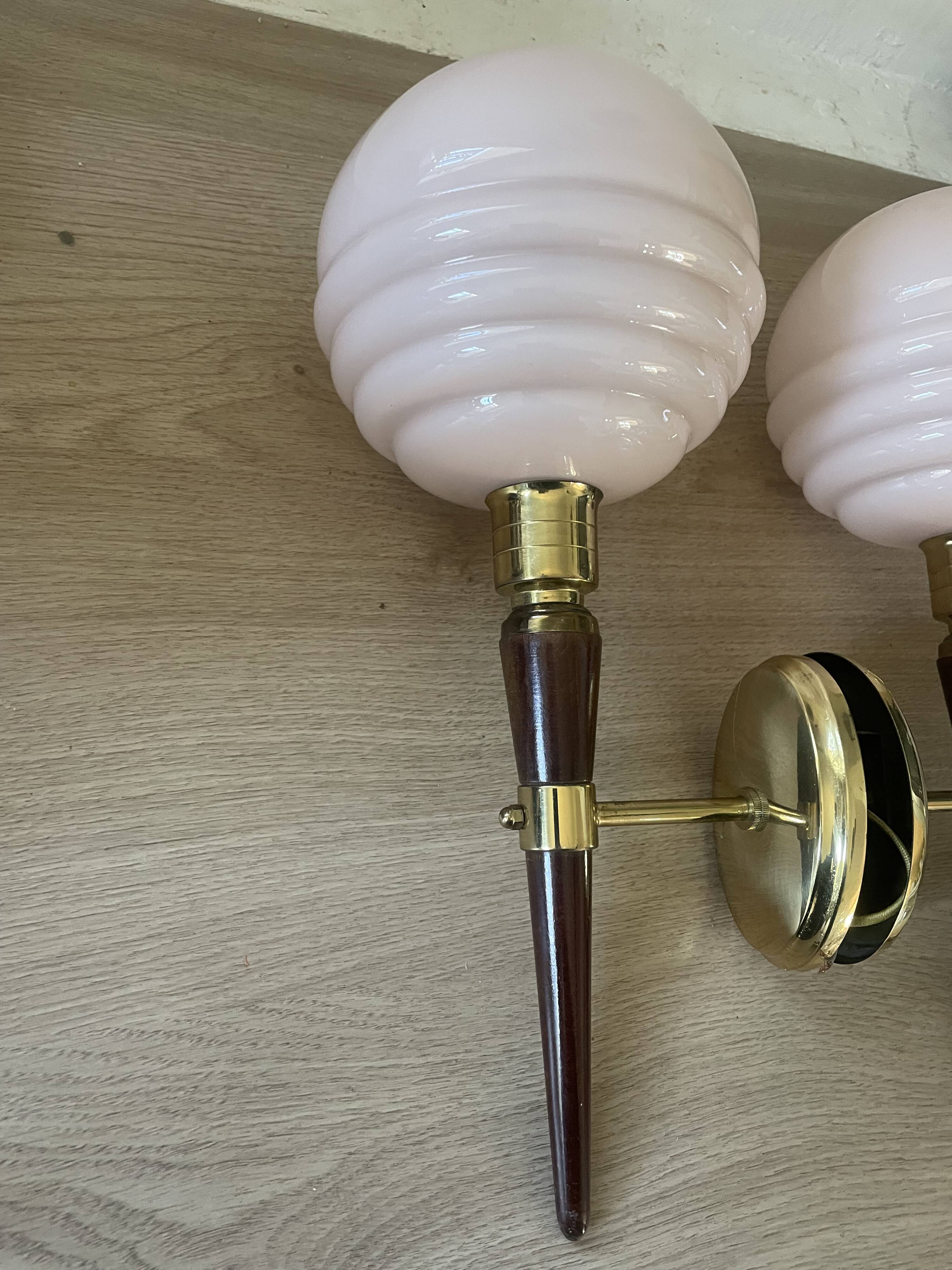 Pair of wall lights in wood, brass, and pink opaline.
